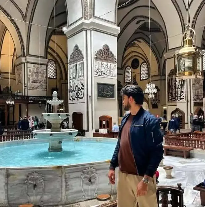 Aziz Mrad beside the fountain inside the Grand Mosque of Bursa